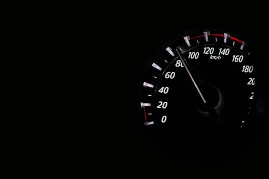 Speedometer reading showing speed in km/h on a dark background.